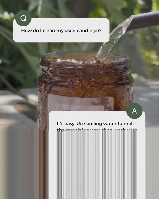Essential oil candle jar being cleaned for reuse